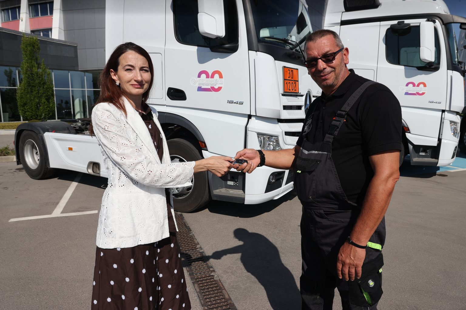 Mrs. Rumiana Ivanova and one of the fuel tank drivers for the new tractor units