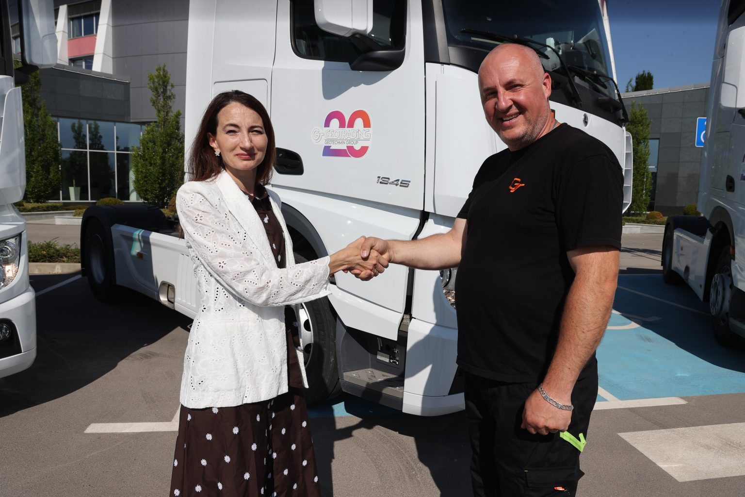 Mrs. Rumiana Ivanova and one of the fuel tank drivers for the new tractor units