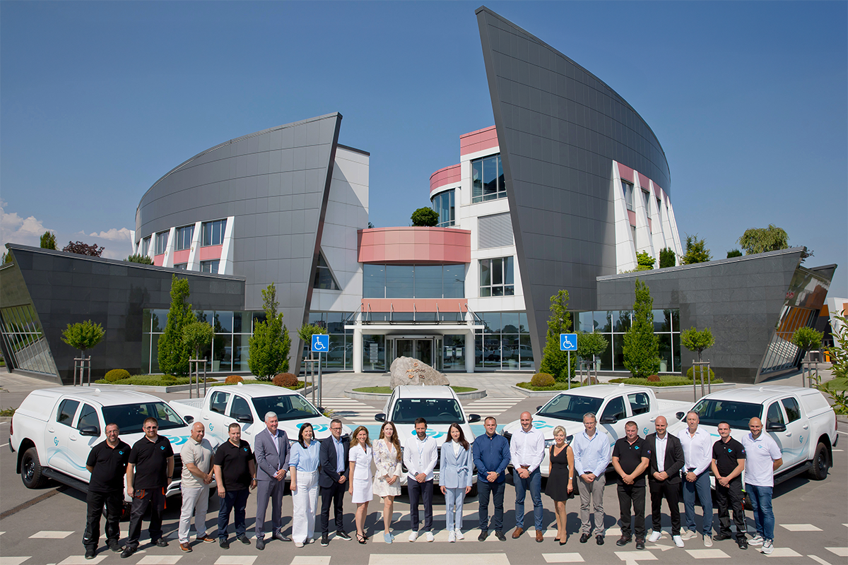Dr. Eng. Ivan Vutov with the board of directors of Geotrading in front of the Toyota Hilux pickup trucks in front of the building of the Proauto multifunctional complex.
